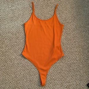 Medium rust orange body suit